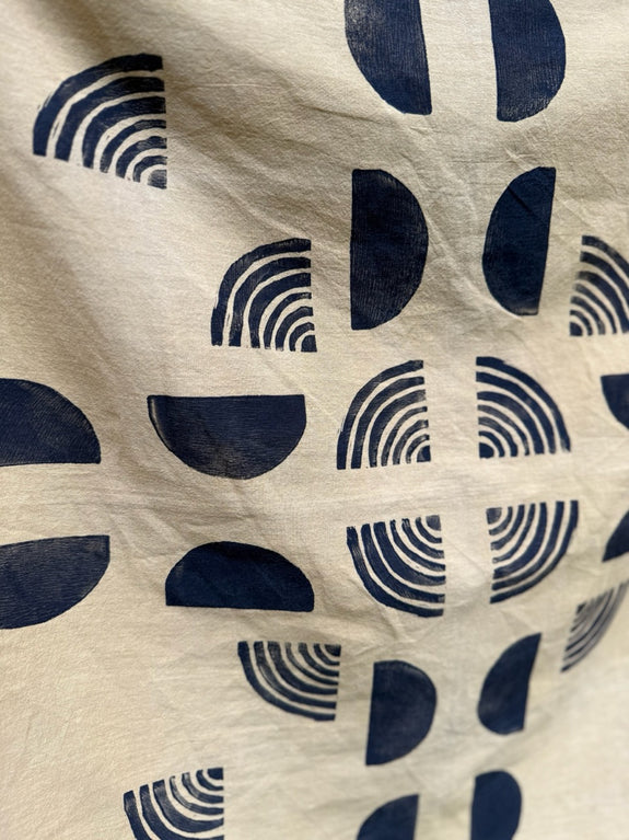A yellow organic cotton bandana with black block prints.
